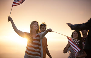 A Group of friends waving american flags